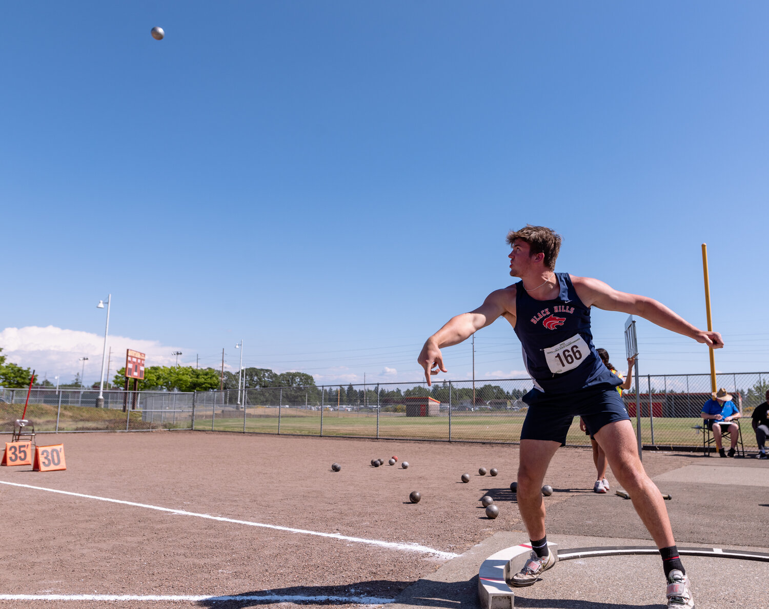 Black Hills’ Liam Wall watches his attempt in the 2A boys shot put at the WIAA 2A/3A/4A State Track and Field Championships on Friday, May 26, 2023, at Mount Tahoma High School in Tacoma. (Joshua Hart/For The Chronicle)
